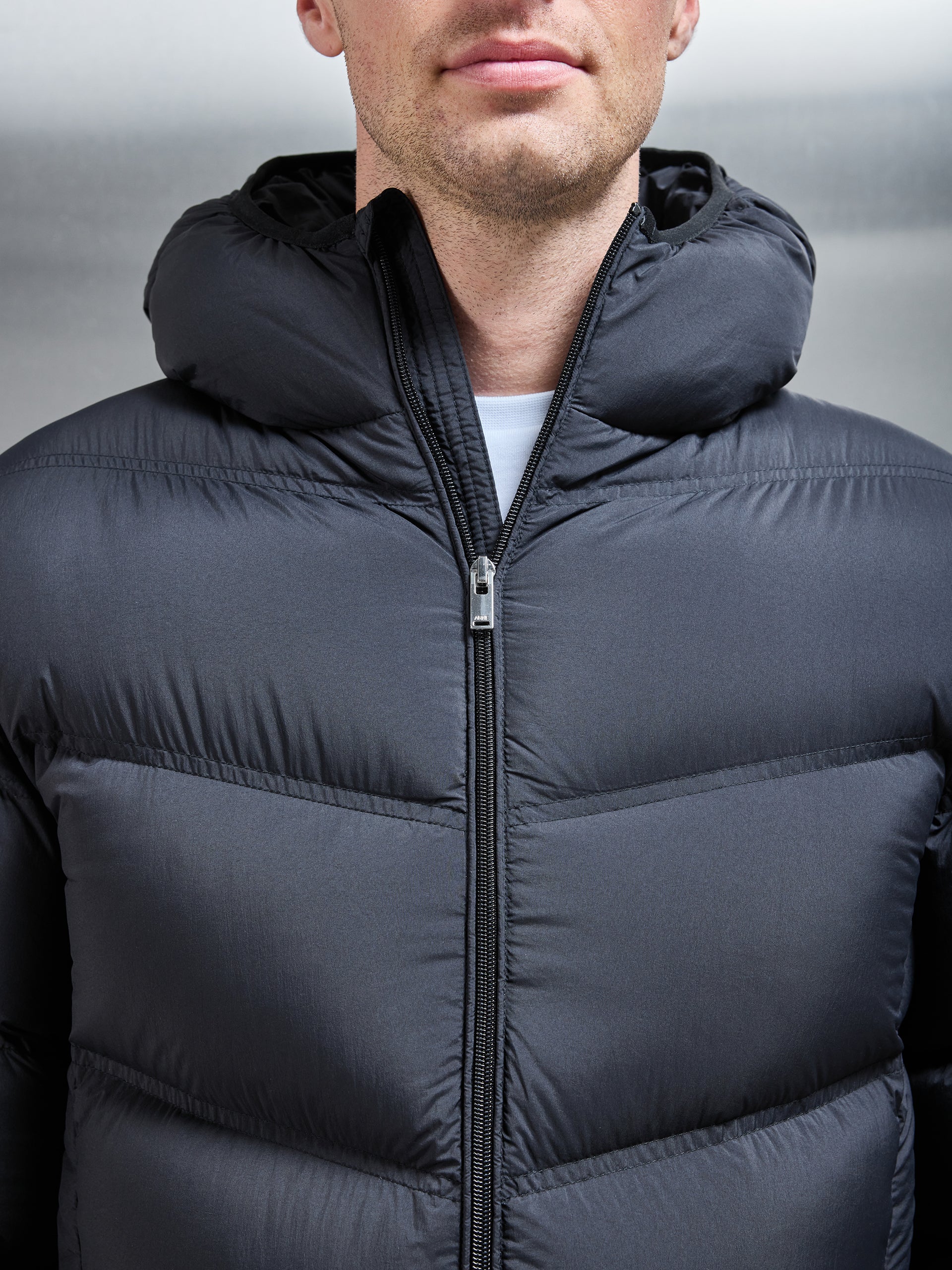 Chevron Down Puffer Jacket in Black