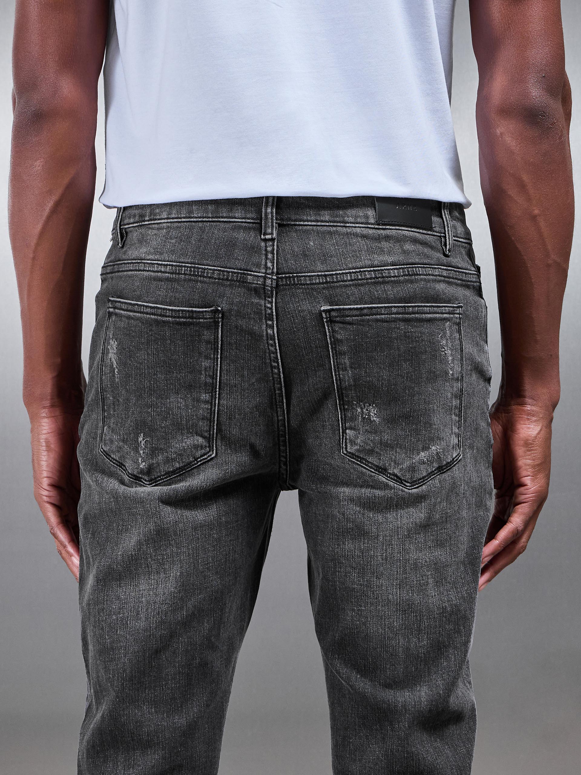 Distressed Denim Jeans in Grey Wash