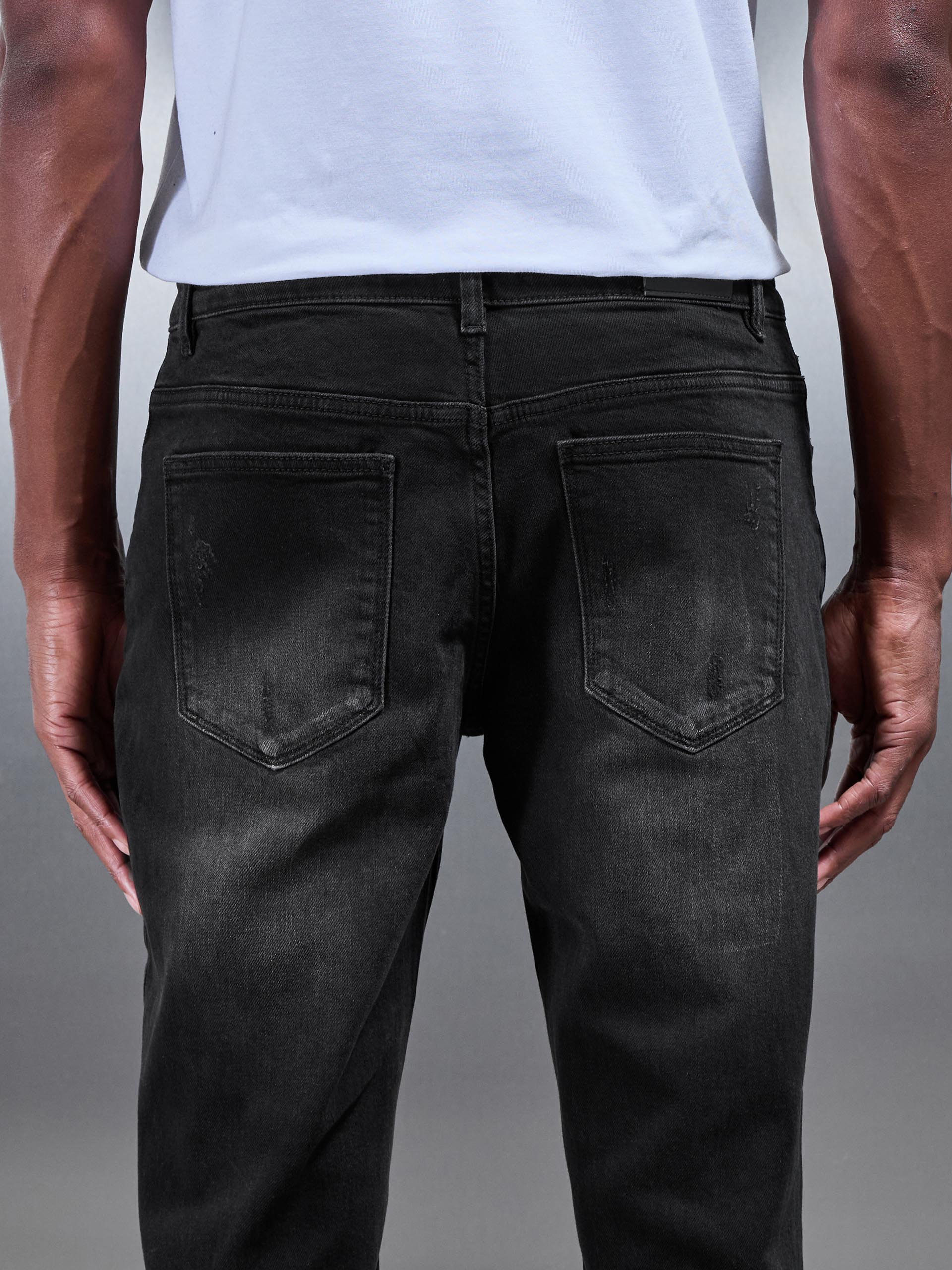Distressed Straight Leg Denim Jeans in Black Wash