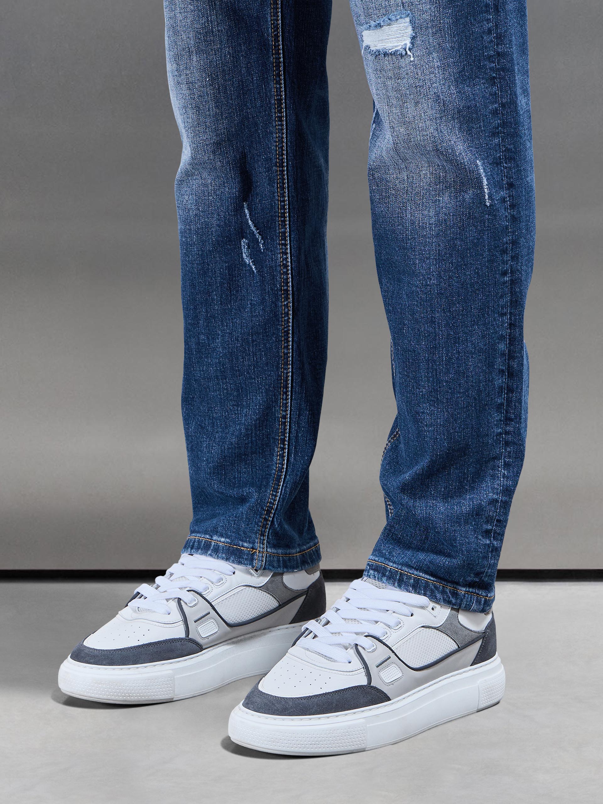 Distressed Straight Leg Denim Jeans in Mid Blue