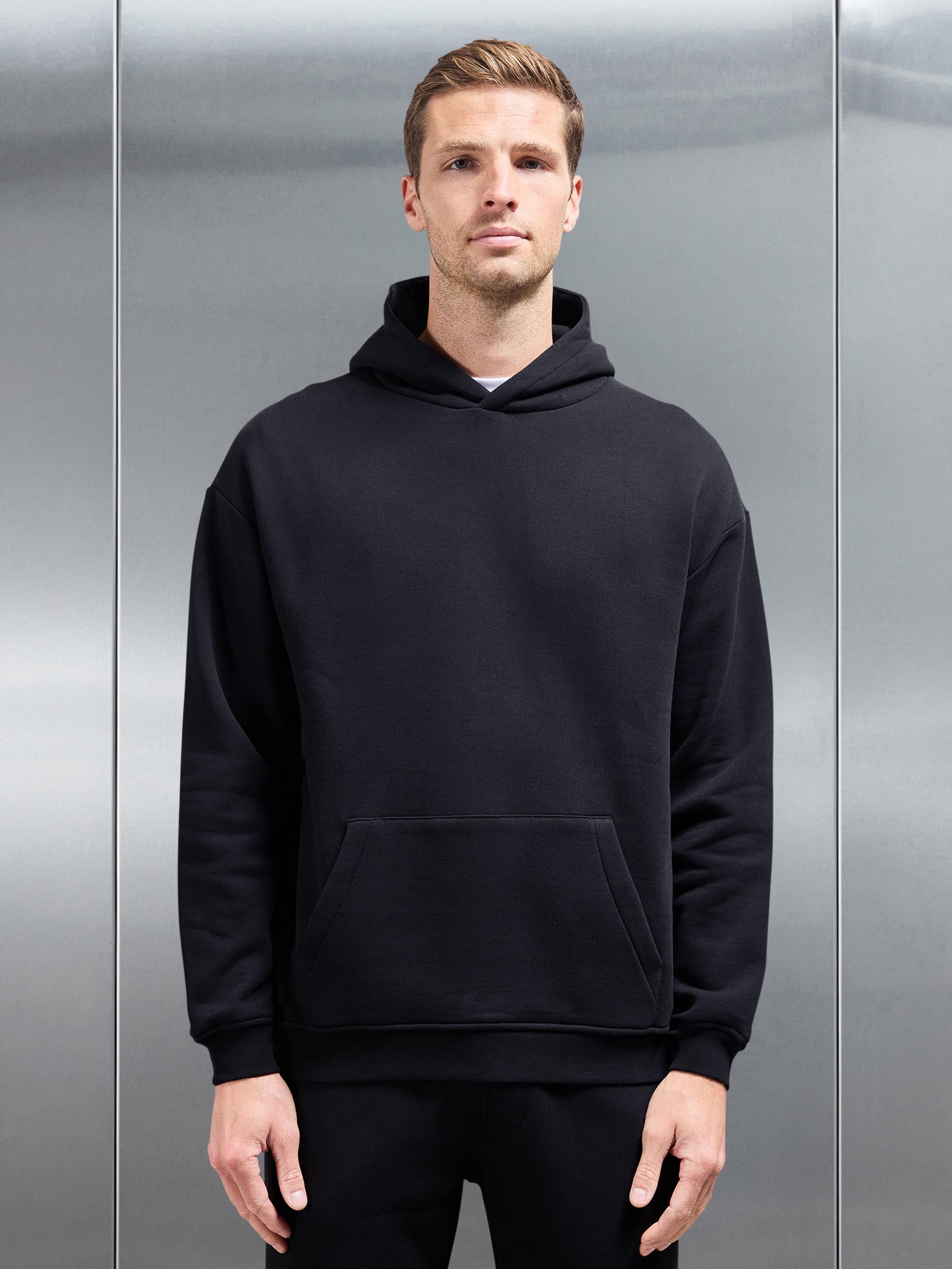 Essential Relaxed Jersey Hoodie in Black