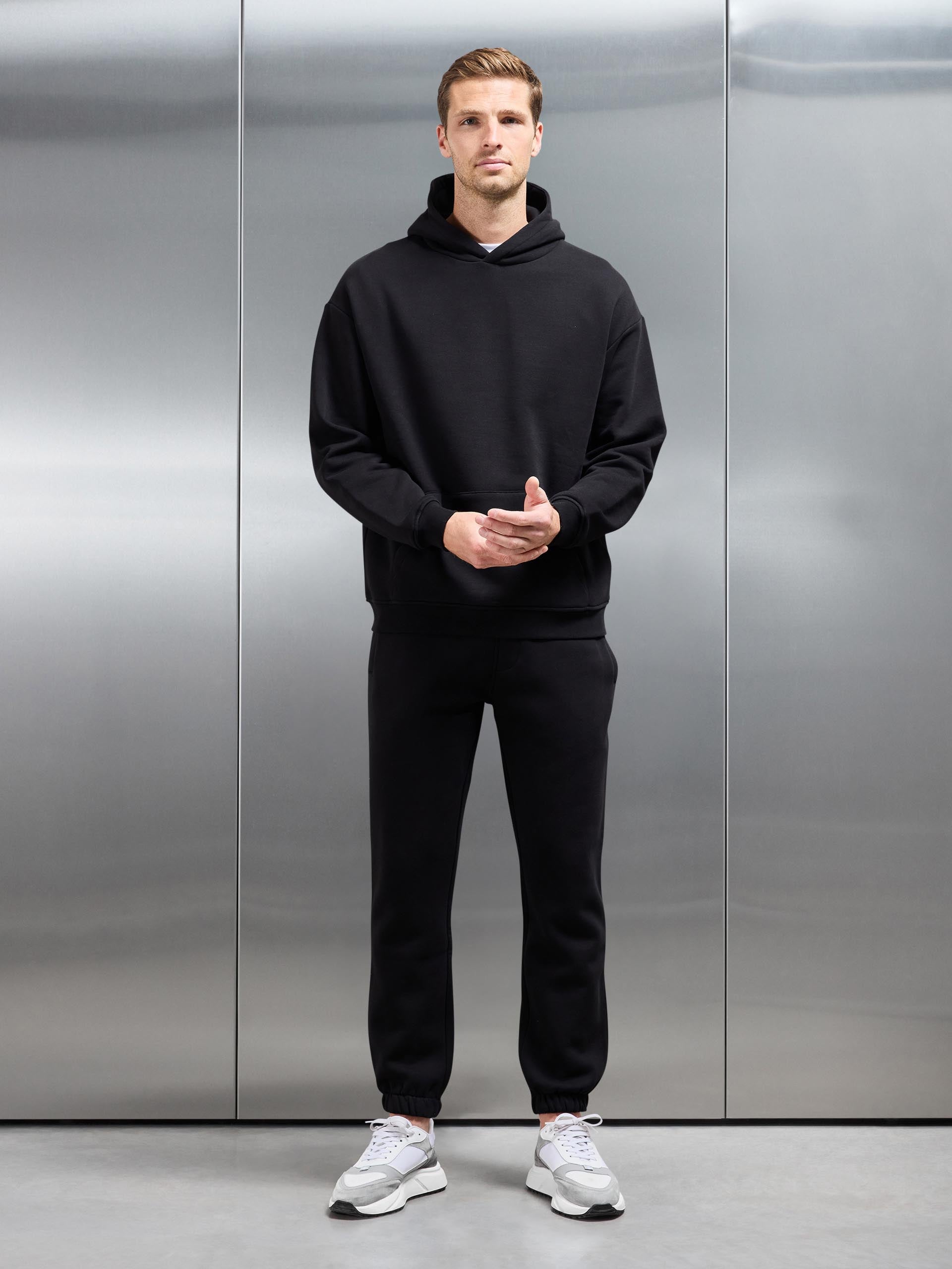 Essential Relaxed Jersey Hoodie in Black