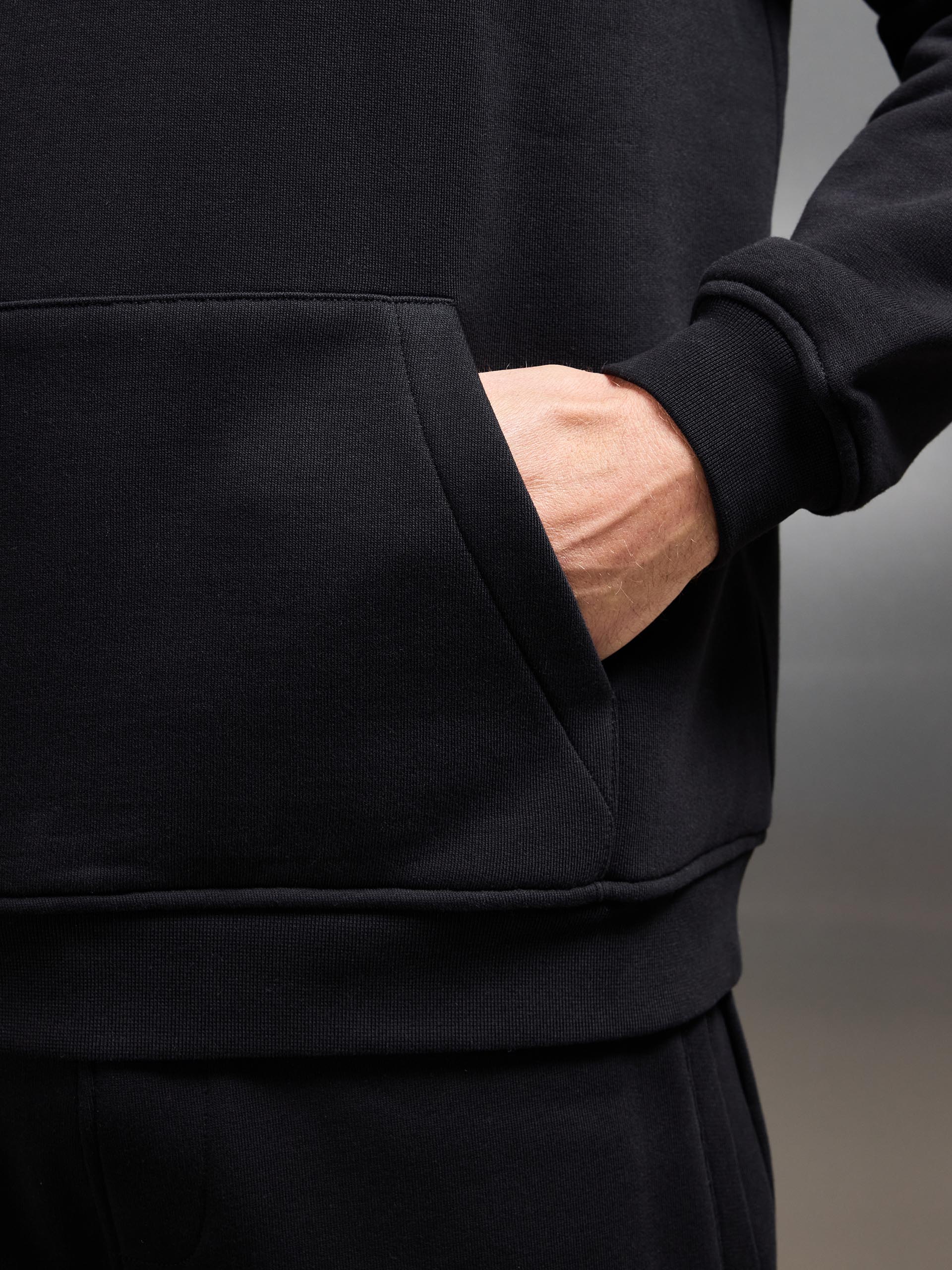 Essential Relaxed Jersey Hoodie in Black