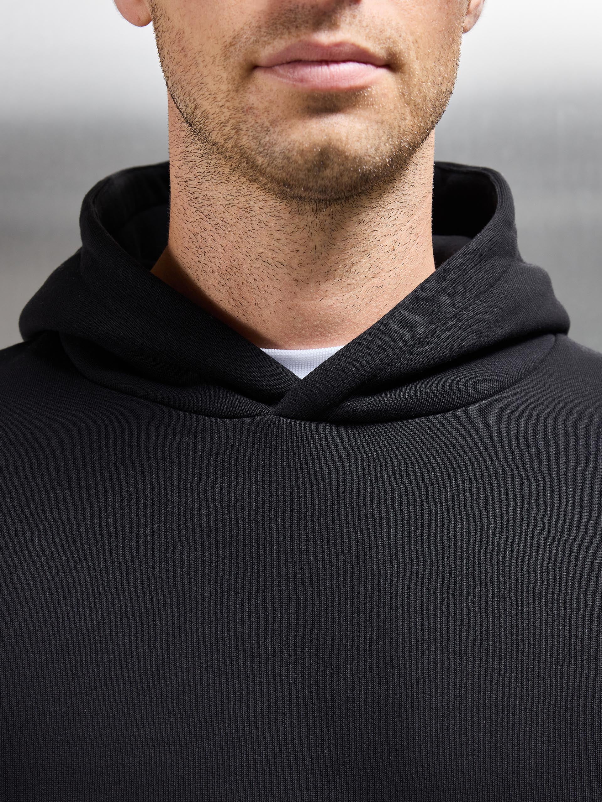 Essential Relaxed Jersey Hoodie in Black