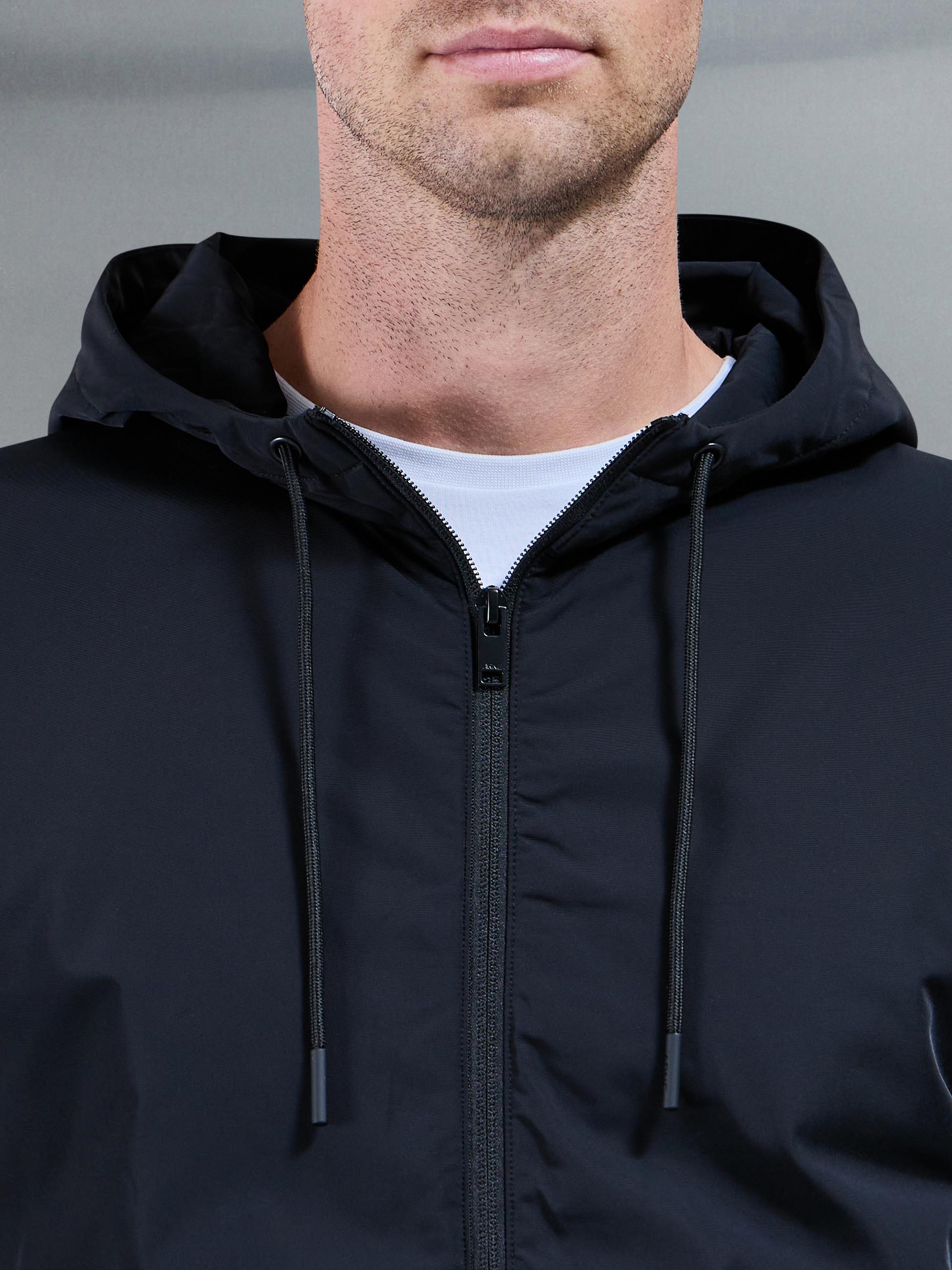 Interlock Jersey Hybrid Technical Windbreaker in Black