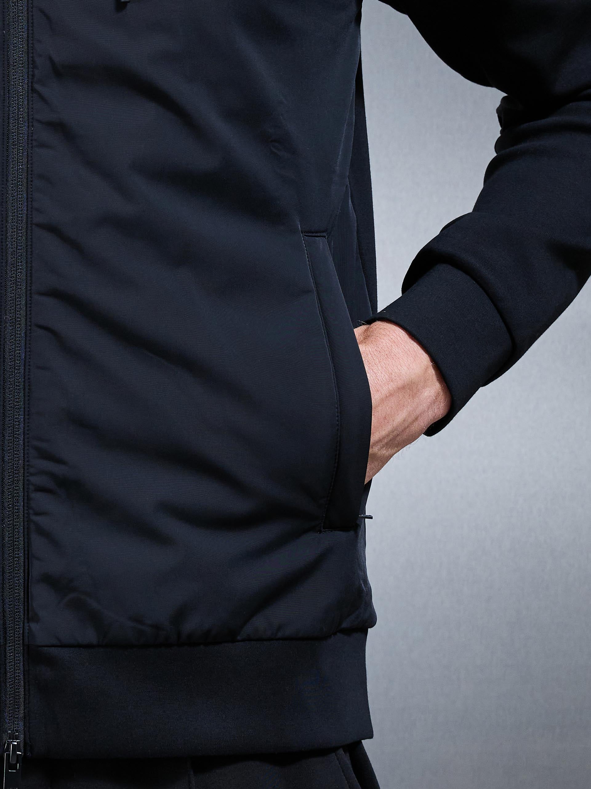 Interlock Jersey Hybrid Technical Windbreaker in Black