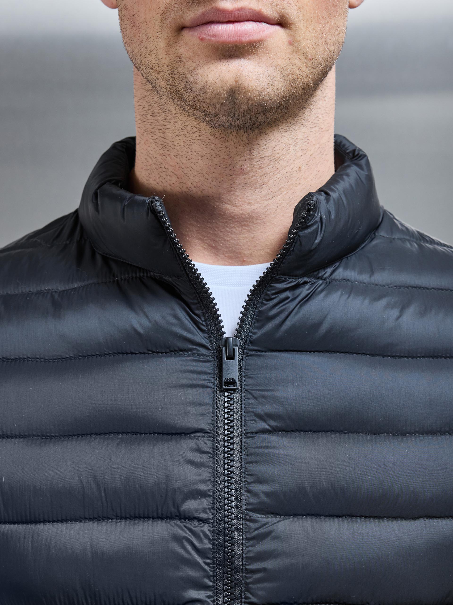 Lightweight Funnel Neck Puffer Jacket in Black