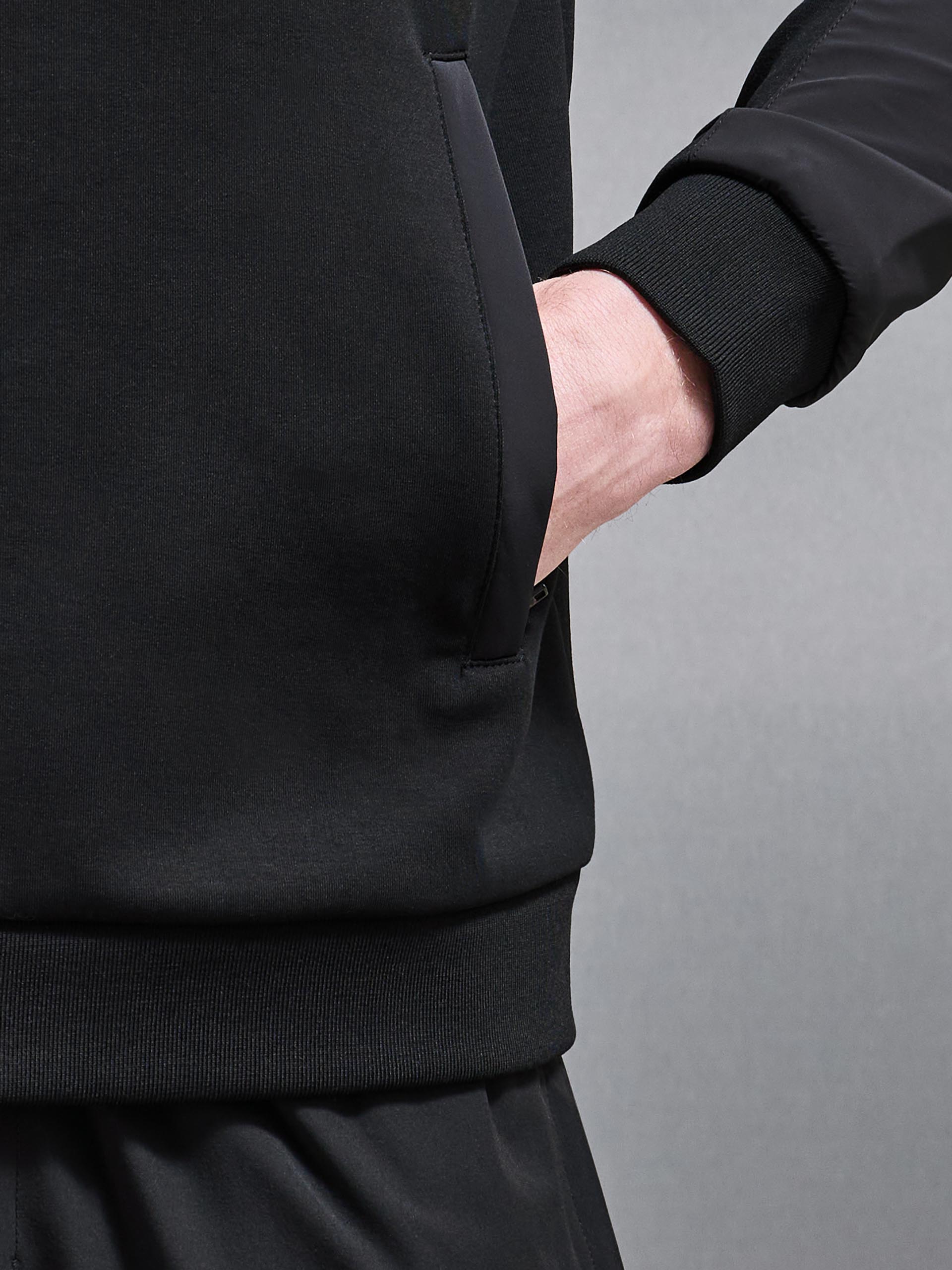 Apex Hybrid Jersey Windbreaker in Black