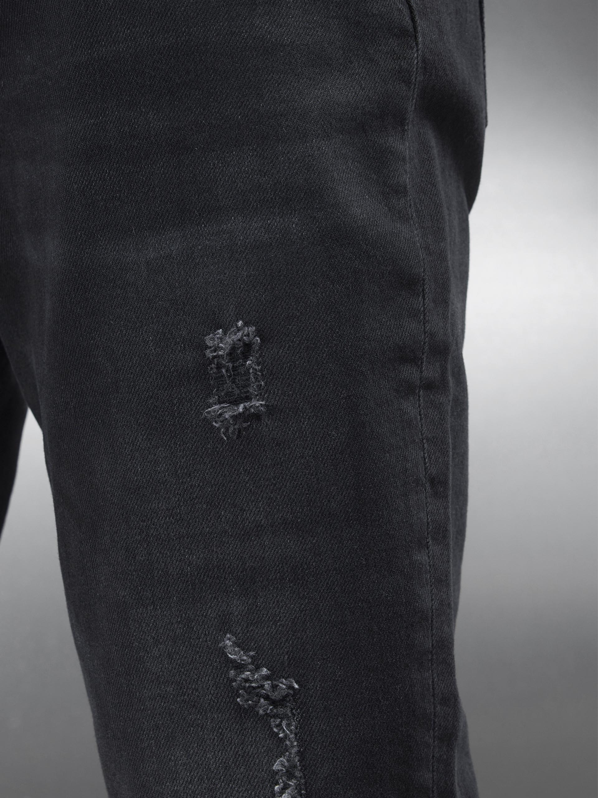 Distressed Denim Jeans in Black Wash