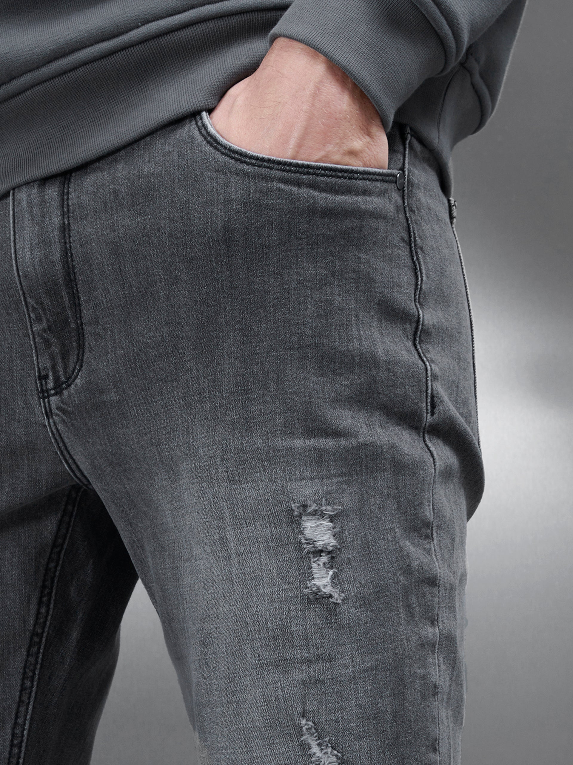 Distressed Denim Jeans in Grey Wash