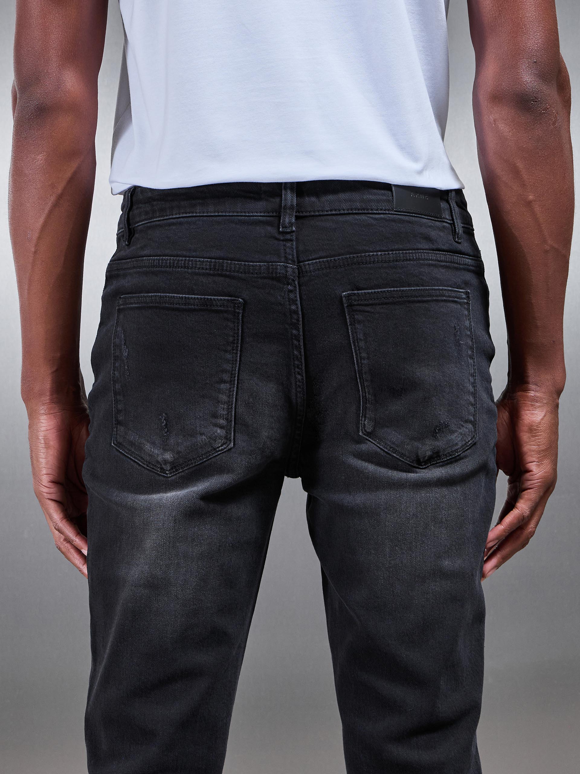 Distressed Denim Jeans in Black Wash