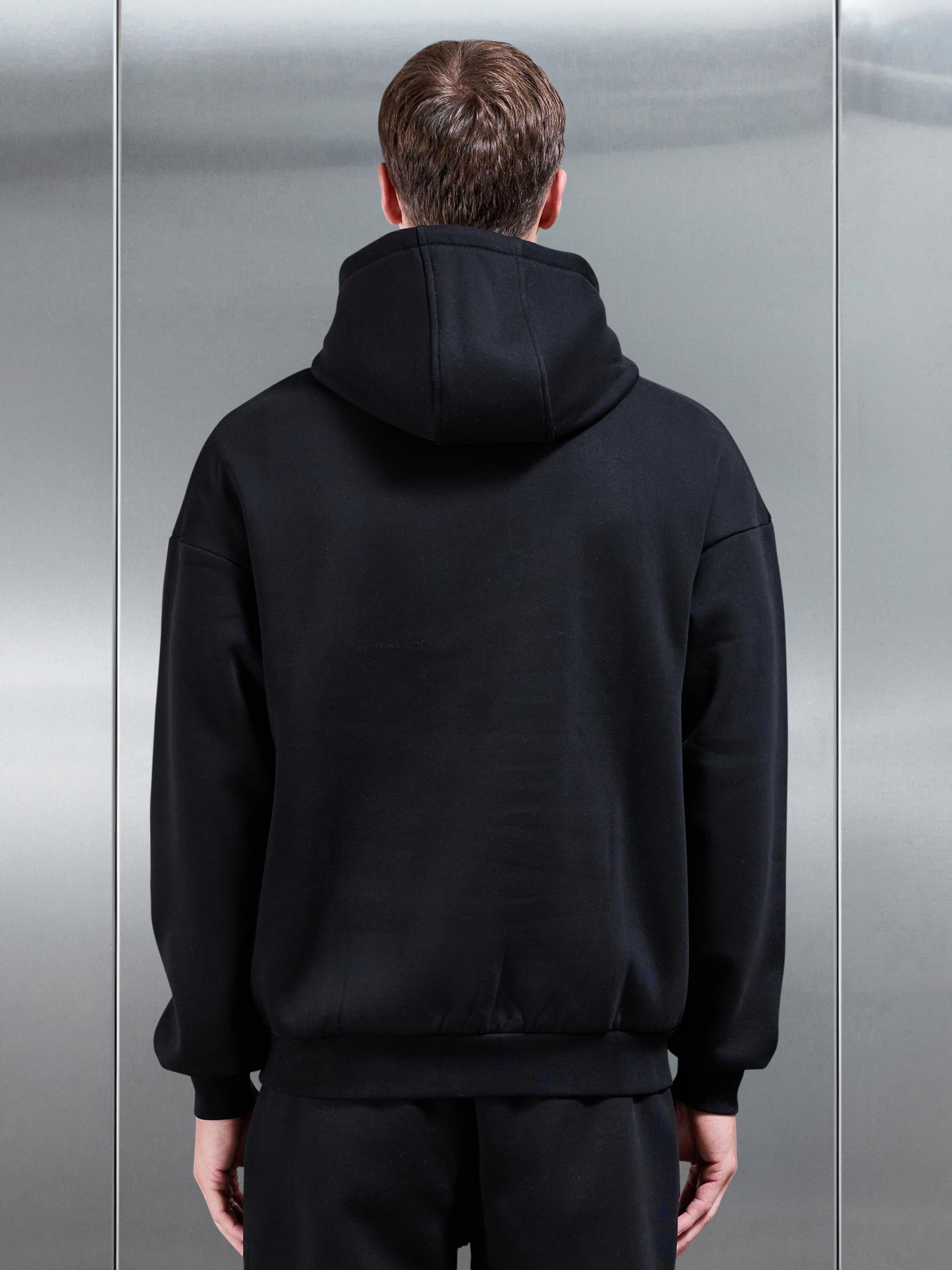 Essential Relaxed Hoodie in Black