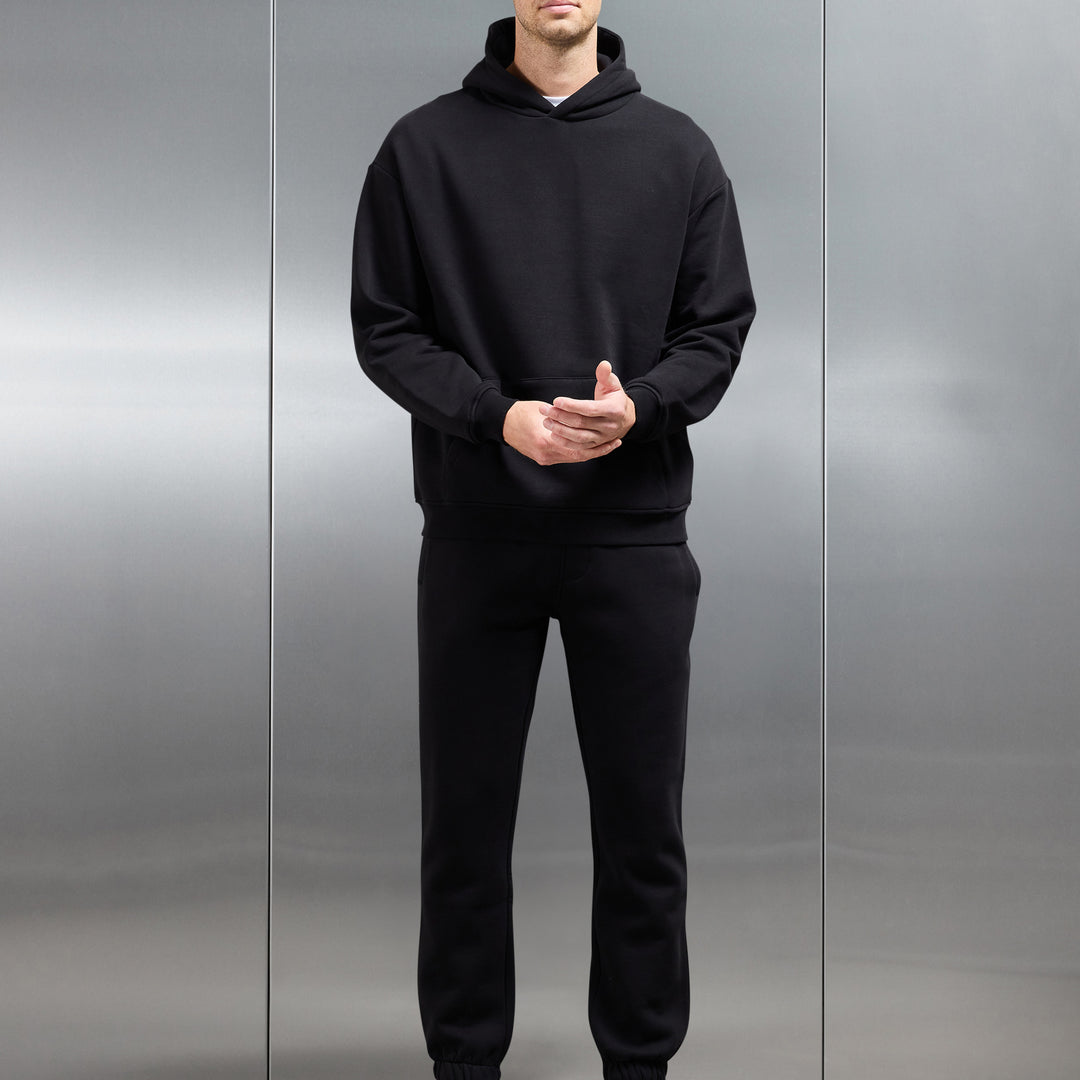 Essential Relaxed Hoodie in Black