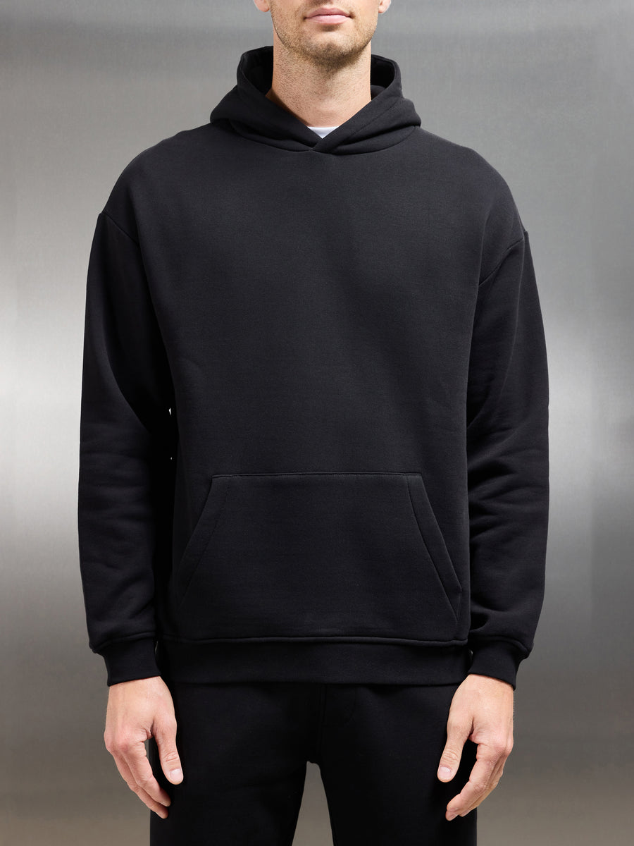 Essential Relaxed Hoodie in Black