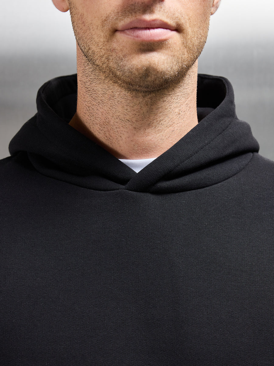 Essential Relaxed Hoodie in Black