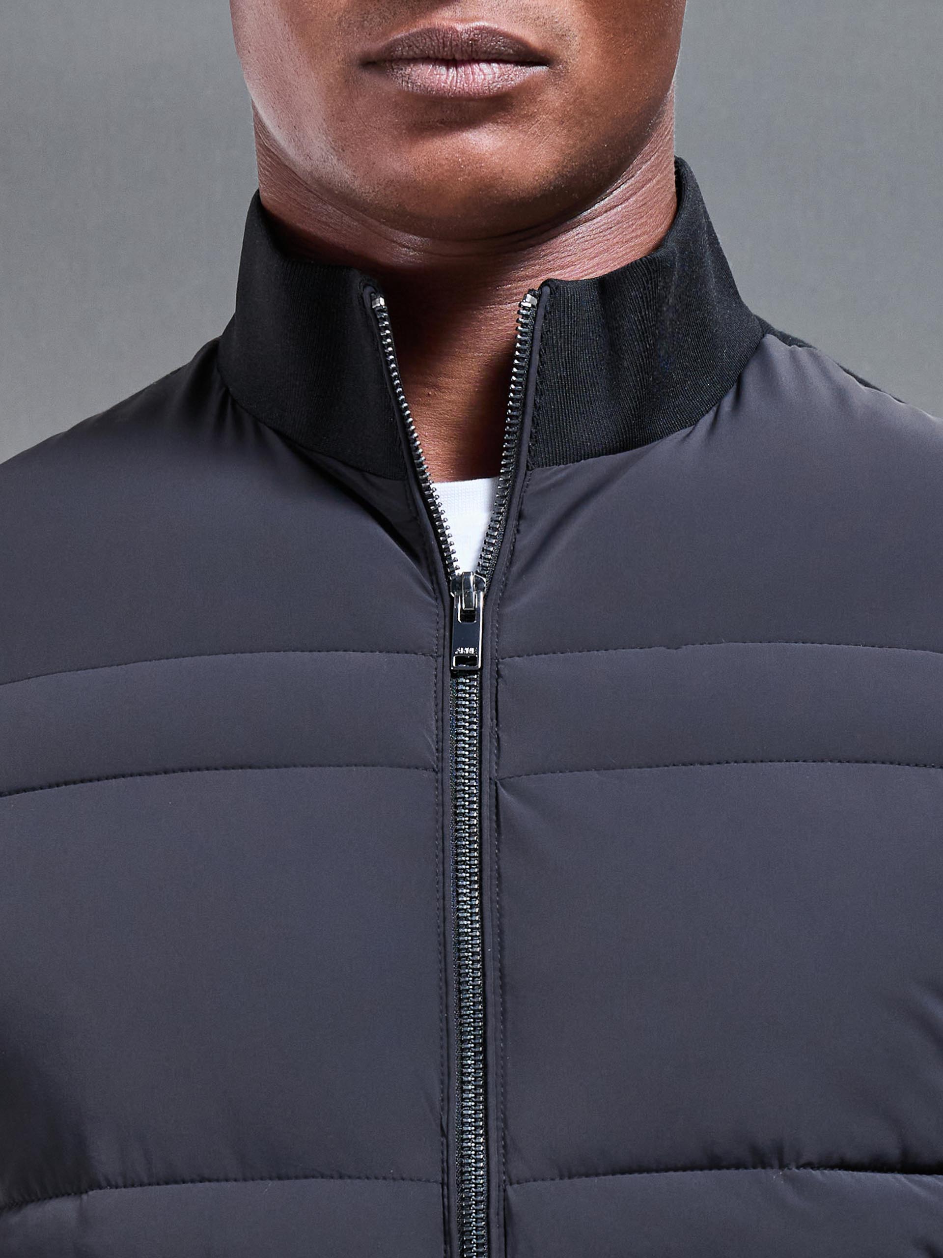 Hybrid Panel Puffer Jacket in Black