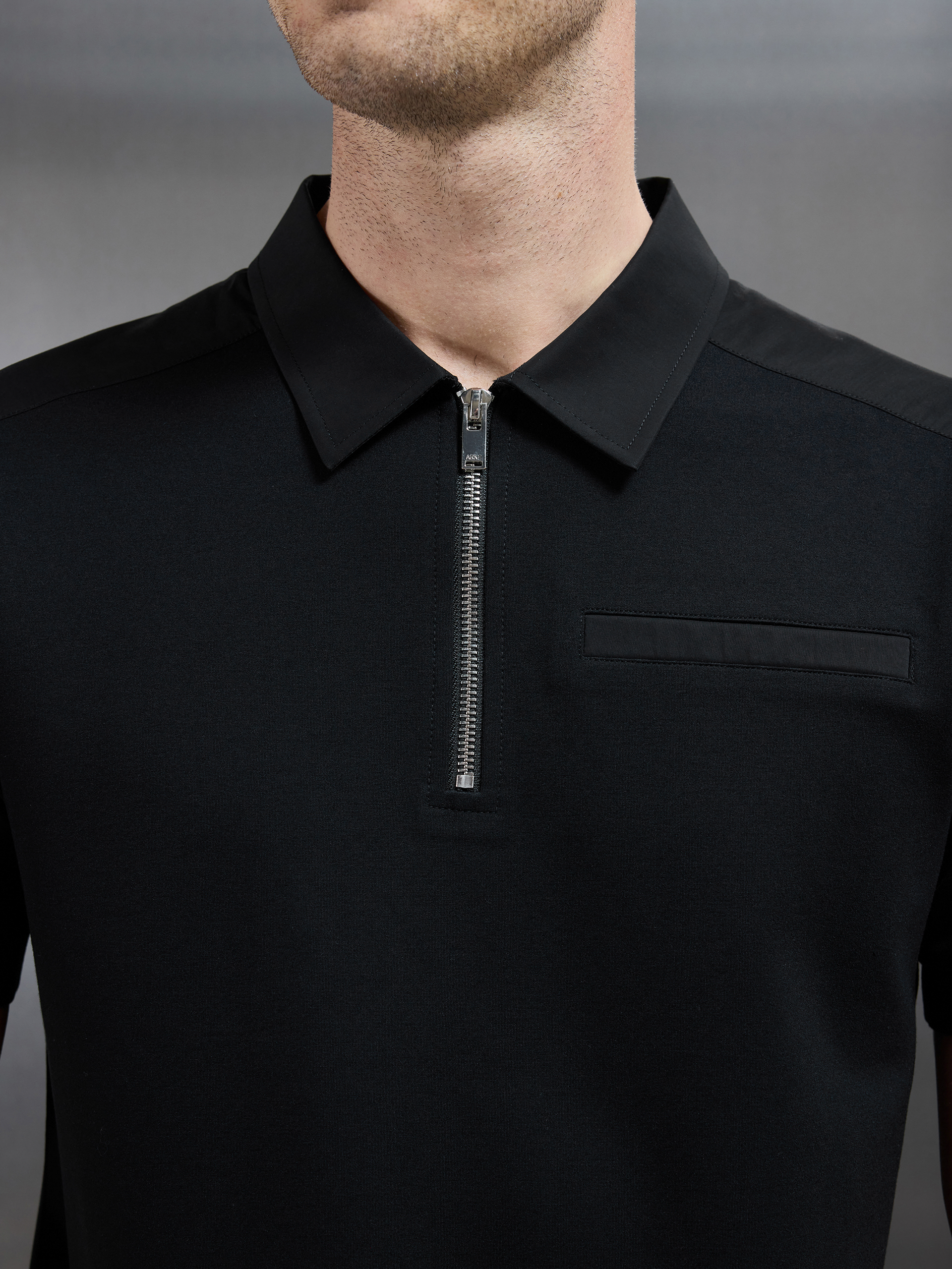 Hybrid Cargo Zip Polo Shirt in Black