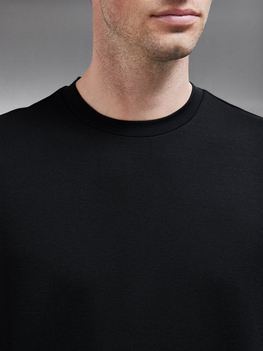 Interlock Relaxed Fit T-Shirt in Black