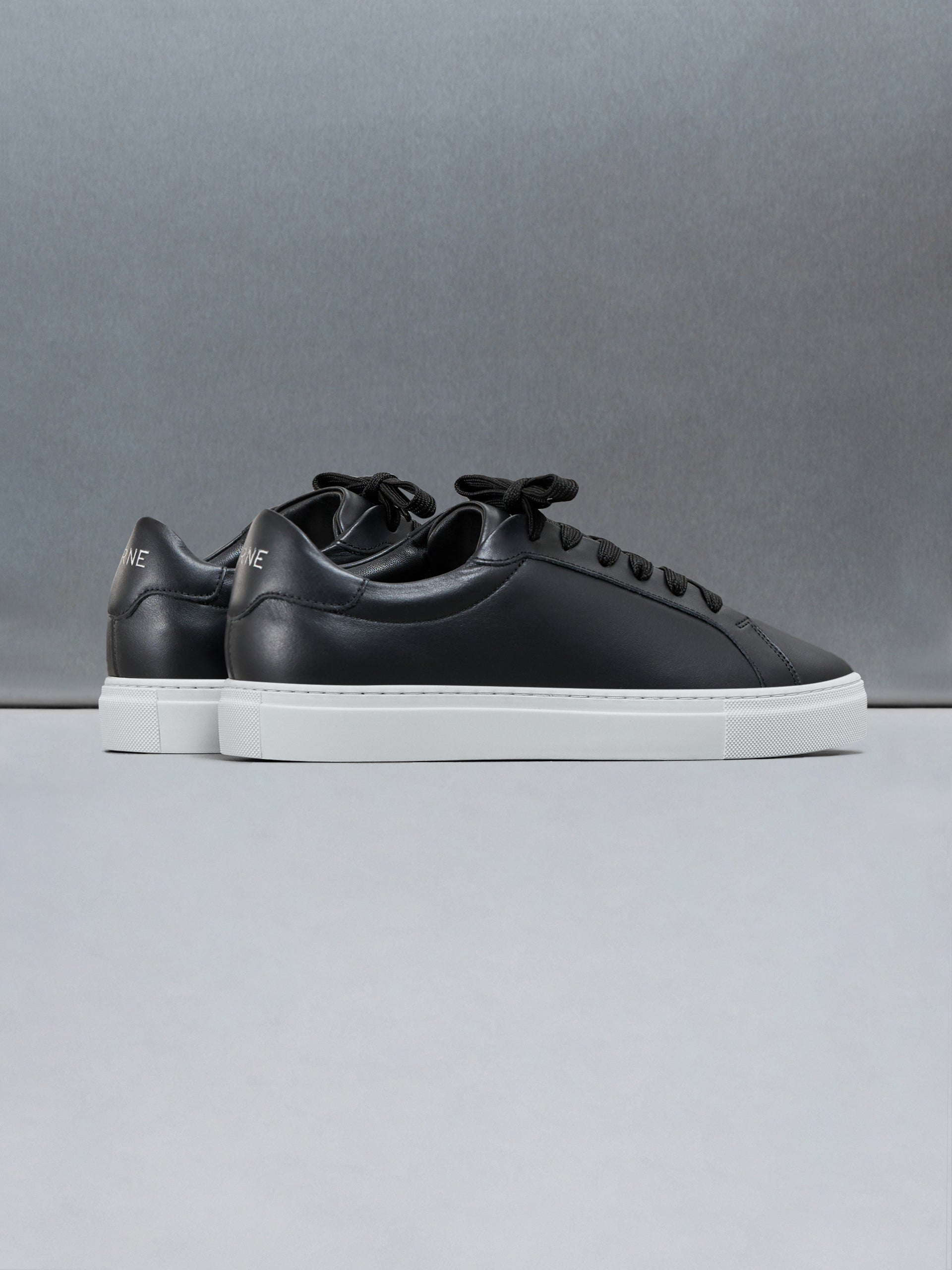 Low Essential Leather Trainer in Black